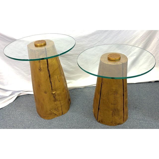 Great pair of modern tree trunk tables from the 1980's. They are made of solid wood tree trunks and painted in an antique...