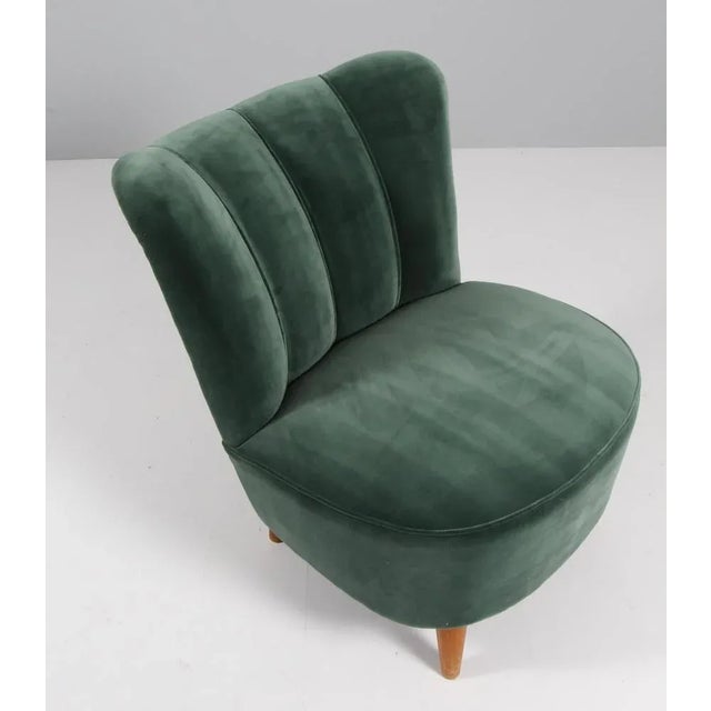 Swedish cabinetmaker cocktail chair / lounge chair. New upholstered with green velvet. Legs of stained beech. Made in the...