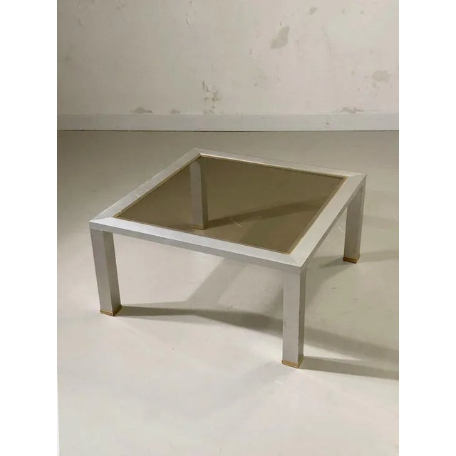 An elegant and rigorous square coffee table, Post-Modernist, Bauhaus, Shabby-Chic, Space-Age, structure in square section...