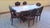 EARLY TWENTIETH CENTURY (1900 - 1940) Piedmontese walnut table with 6 matching chairs – early 1900sImportant Piedmontese...
