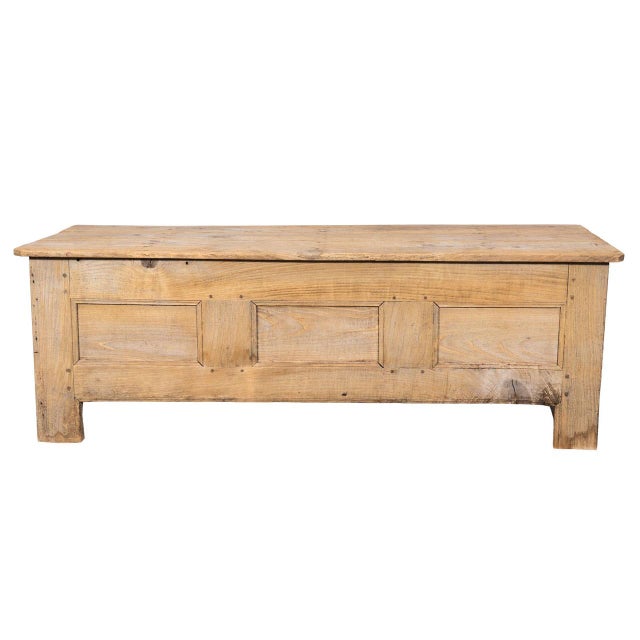 Paneled scrubbed oak trunk with self-foot. Hinged lid.