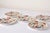 Five english stoneware plates in the japanese style 'kakiemon tiger' pattern mid-19th century, the foliated edges with...