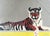 A wonderfully graphic and distinctly collegiate hand-stitched needlepoint depicting a reclining tiger, signed and dated...
