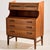 Danish teak bureau desk in restored condition with seven drawers and extendable writing board and mirror. The furniture...