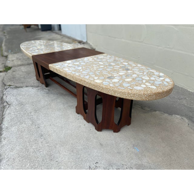 Mid-century modern terrazzo marble and walnut fretwork coffee table by Harvey Probber. Elegant geometric fretwork at the...