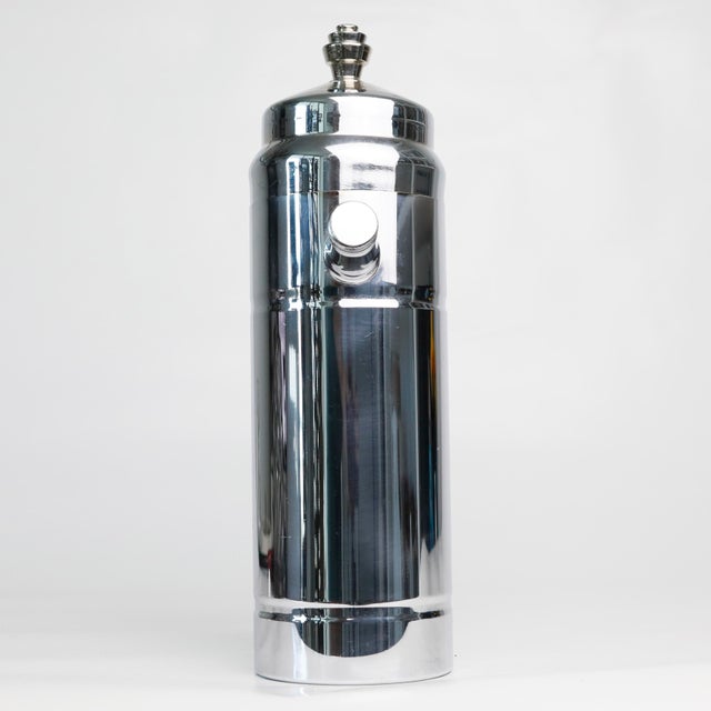 A prohibition era art deco chrome stacked finial cocktail shaker by Derby Shelton. This piece features a squared off...