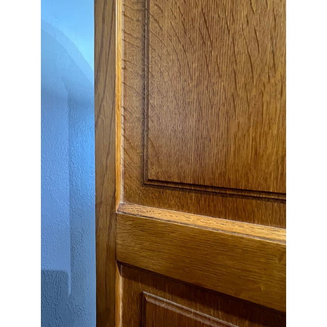 This vintage Belgian oak display showcases warm oak, ornate carvings, and elegant brass hardware. A striking fusion of...