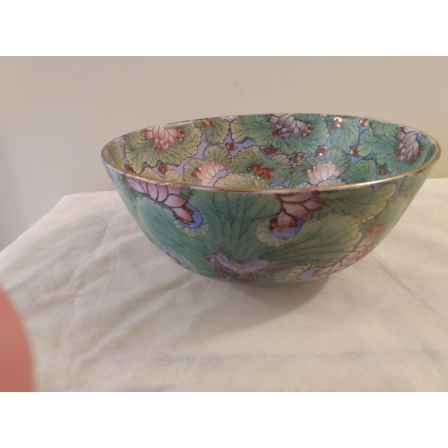 What a beauty. This enchanting lively bowl is intricately hand-painted in its entirety in a waterlily print with gold...