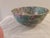What a beauty. This enchanting lively bowl is intricately hand-painted in its entirety in a waterlily print with gold...