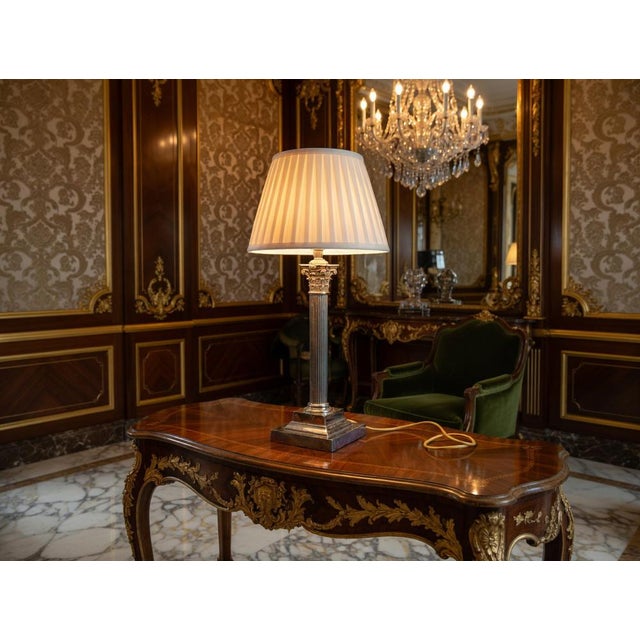 This striking silver plated column lamp is a refined decorative piece, designed to bring elegance and timeless appeal to...