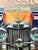 A dramatic vintage Mirage Editions wall art print depicting the front profile of a classic Mercedes-Benz roadster in...