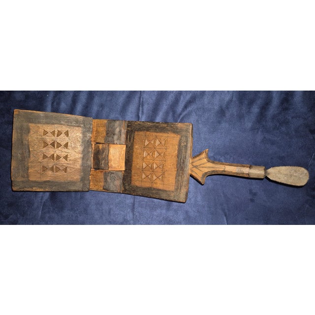 This appears to be an authentic vintage mbuzi (Swahili for "goat"), a traditional folding coconut-grater stool from East...