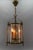 French brass and clear glass three-light round hanging lantern from circa the 1950s. This adorable three-light pendant...