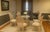 This custom dining table hails from a Montauk, Long Island estate. This faux bois dining table is from the late 20th...