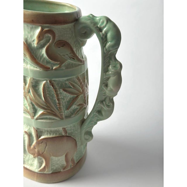 A highly decorative Art Deco ceramic jug by Burleigh Ware, produced by Burgess & Leigh in England around the 1930s. This...