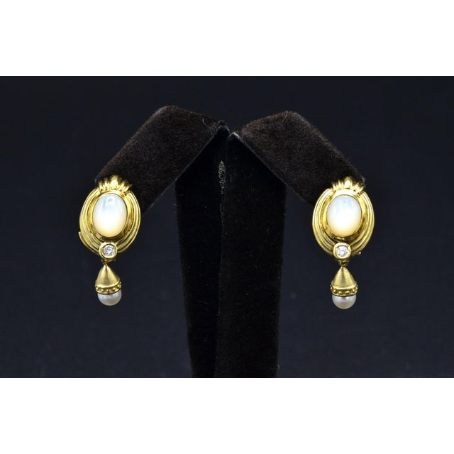 The Gretnas: Ladies Vintage 14K Day and Night Mother of Pearl Dangler Earrings. Crafted in 14 karat yellow gold, these...