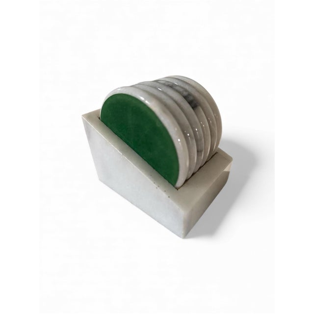 6 round marble coasters • Matching Carrara marble storage box • Green felt backing to protect your furniture surfaces...
