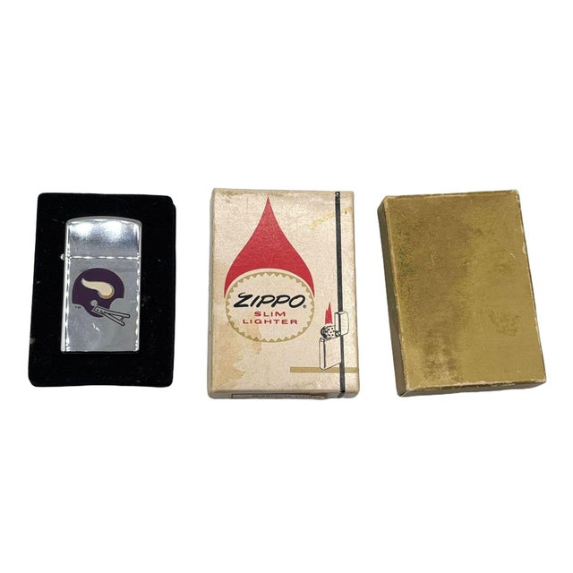1970s Minnesota Vikings Vintage Zippo Slim Lighter with Original Box and booklet. The lighter featuring an enameled...