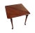 A mahogany handkerchief table. With the leaf down, the table is triangular. When the leaf is raised and supported by the...