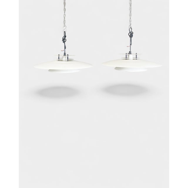 Original pair of Danish pendant lamps from the Laterna Danica series, designed by Jørgen Buchwald for Nordlux. This Ø50 cm...