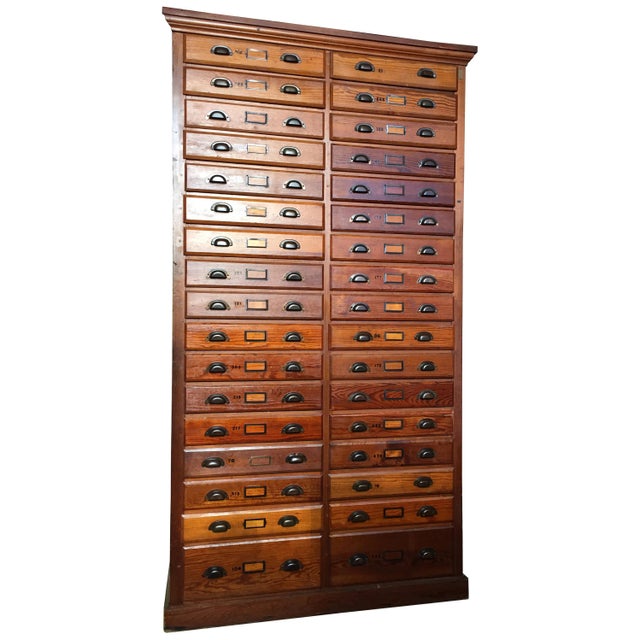 8FT antique printer's flat file cabinet Striking 1930s-1940s industrial cabinet featuring 34 drawers. Rich warm wood with...