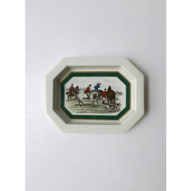 A porcelain jewelry dish with equestrian horse scene, circa mid-20th century, Europe. An octagonal jewelry dish/small...