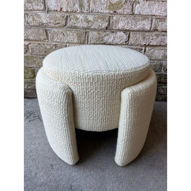 Vintage "wrap" pouf, France. This vintage ottoman has been newly reupholstered in a Cowtan & Tout off white textured...