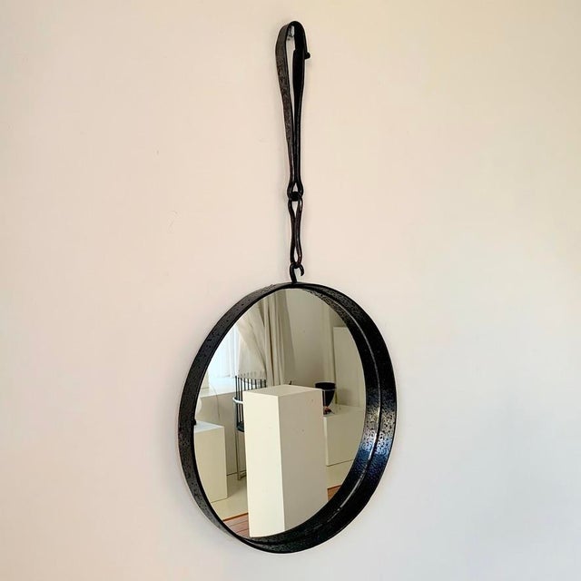 Brutalist round wall mirror, circa 1950, France. Wrought iron, mirror. Good vintage condition. Dimensions: 83 cm total...