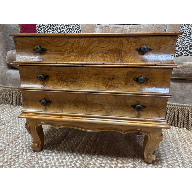 A vintage Italian Burl Walnut faux book end table with beautiful honey-colored Circassian Walnut veneer, the lift top lid...
