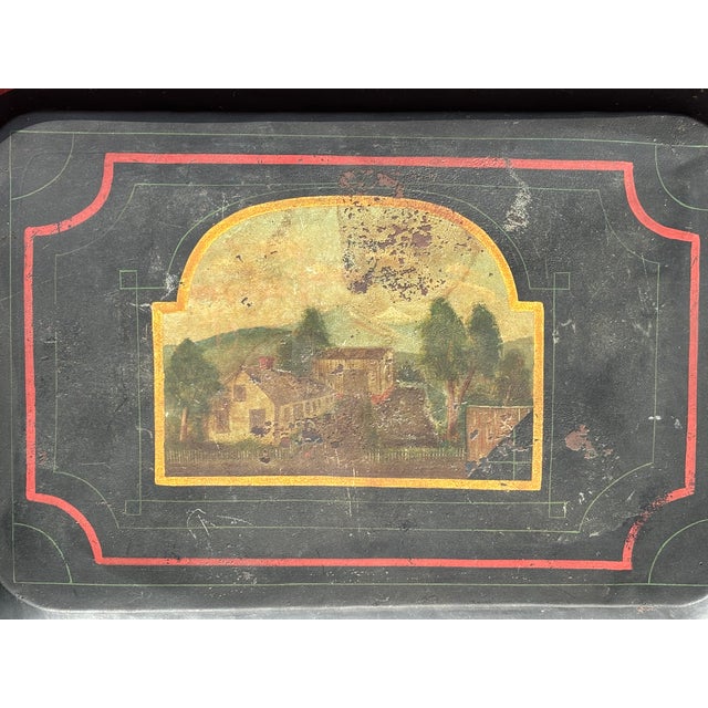 Large and hand-painted 18th C American Tole tinware Tray. Black ground with red, green and gold detailing with a New...