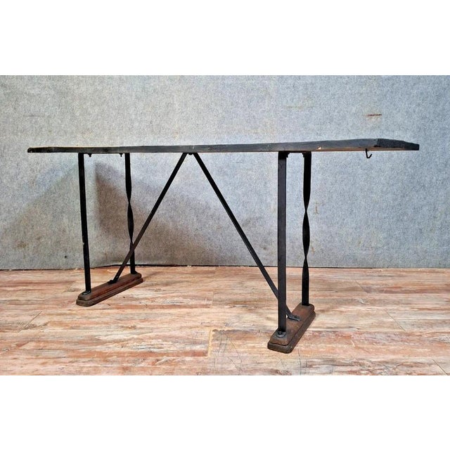 Stunning industrial-style console/table, full of character. the tabletop is made of reclaimed wood with a beautiful patina...
