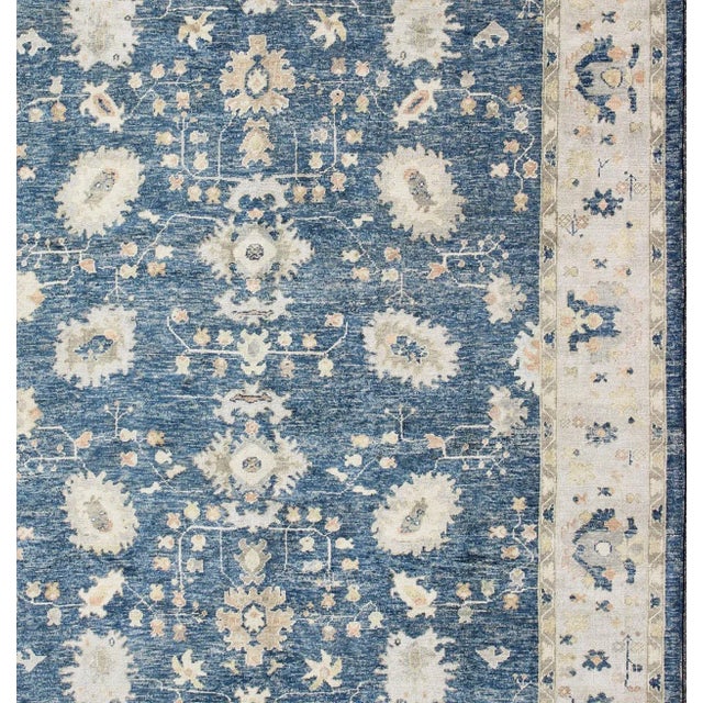 Turkish Oushak rug in blue background and all-over flower design. Keivan Woven Arts / rug EN-165651, country of origin /...