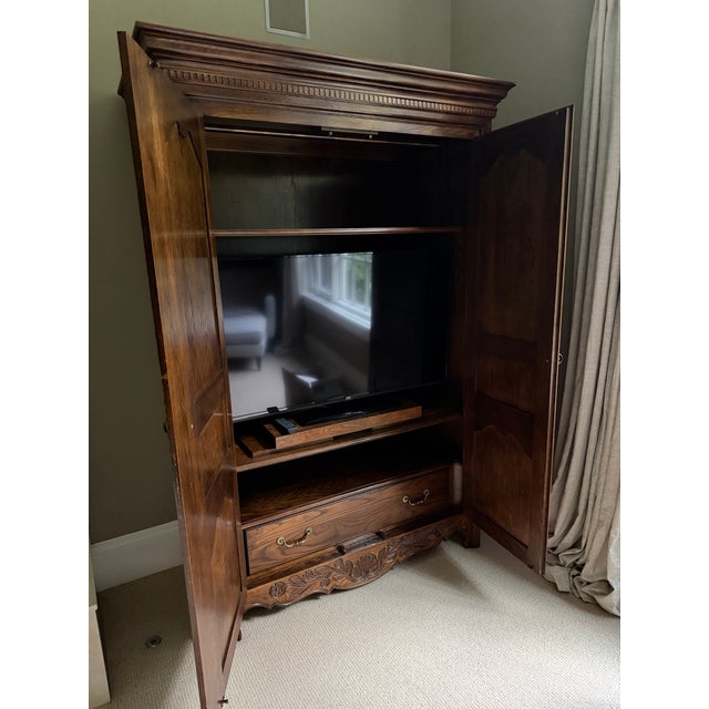 Gorgeous in prime condition. Interior has large drawer at bottom, 2 adjustable shelves and hanging rod