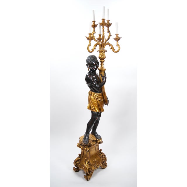 This impressive Italian Venetian-style Blackamoor torchiere floor lamp dates to the mid to late 20th century, circa...