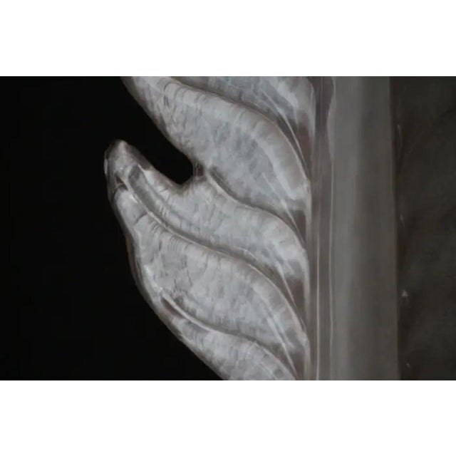 This is a very nice pair of pearly pink blown murano glass sconces in a shape of a leaf or a feather on a polished golden...