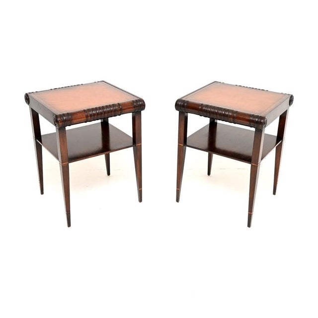 A beautiful and extremely well made pair of antique Regency style leather top side tables. They were made in England, they...