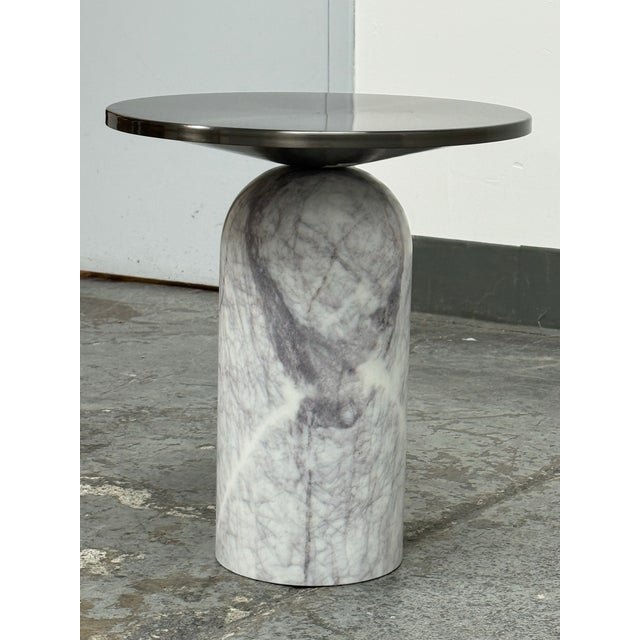 Design Plus Gallery presents the Martini Marble Side Table by VUUE for CB2. The round brushed gunmetal steel top rests on...