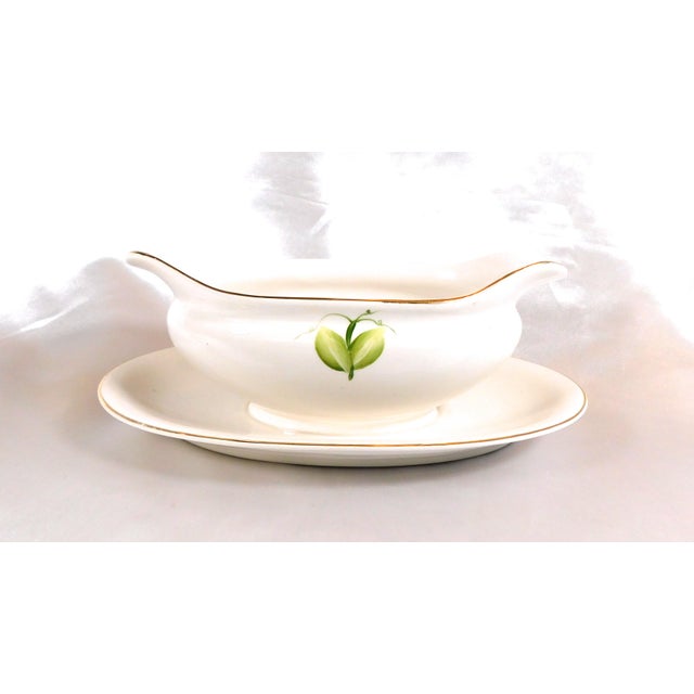 This is a white gravy boat with an attached underplate marked The Ironstone China and Matsumra & Co. I have not found any...