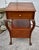 Antique (1910's) Table Stand has a Chippendale Style. The Stand has One Drawer, One Locking Door. Made of Wood. Mahogany....