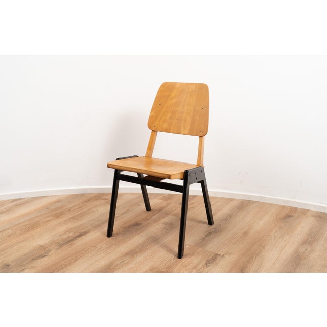Vintage chairs by Zwager Ermeloo. The chairs is made out of wood with a black coated wooden base. I have official proof of...