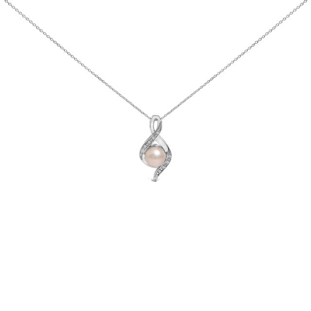Embrace the dance of elegance with this rhodium-plated .925 sterling silver pendant necklace, crafted to captivate and...