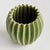 With a rounded form, deep ribbing and thickly applied glaze, this natureinspired pot is a work of art. The handfinished...