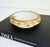 An ornate mid-20th-century vintage Italian alabaster ashtray or catchall bowl with a decorative gilt-brass metal ivy leaf...