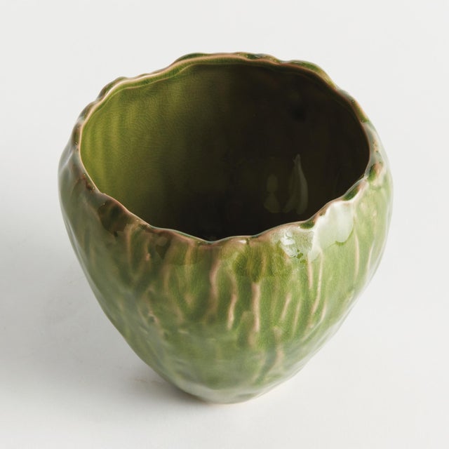 In an artisanmade slip cast design, this intricate natureinspired pot is a real treasure. The inherently beautiful glaze...