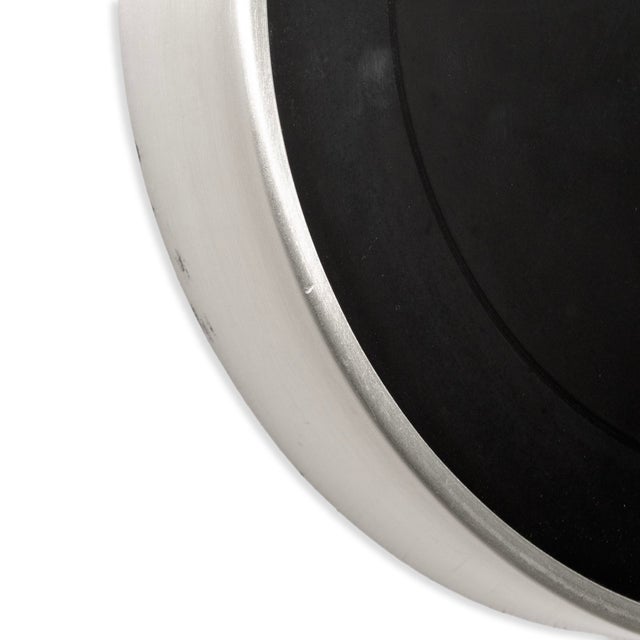 Vintage Howard Miller Modern Minimalist Wall Clock. This clock features a brushed steel outer casing with aluminum hands...