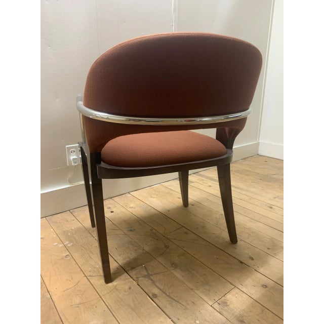 The Willow chair by Brueton is shown here in brown fabric with a black frame. The graceful curves of the hardwood legs...