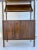 Here is a fantastic piece made in the mid-century in the Danish Modern design style. The piece is a mixture of cabinet,...