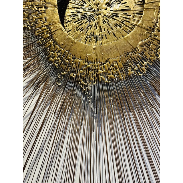 This is an amazing original large 1960s wall mounted copper and brass brutalist sunburst sculpture attributed to New York...