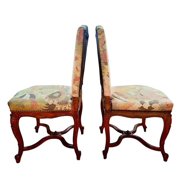 This exquisite pair of antique French side chairs is executed in the majestic Louis XIV Style, blending grand Baroque...