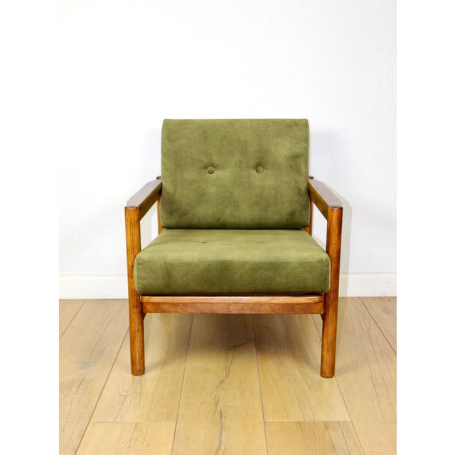 Wooden armchair designed by Z. Baczyk in brown vintage with yellow-olive upholstery. A 1970s armchair with removable...